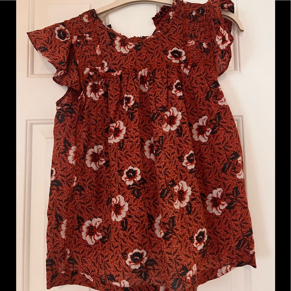 Flutter sleeve top! Perfect for work. Great with black or white denim.